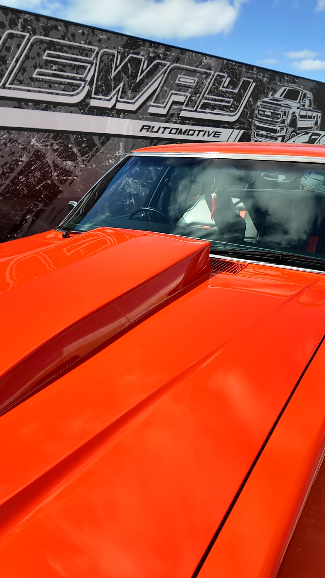 Orange muscle car bonnet detail